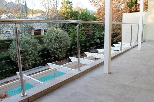 Tubular stainless steel balustrade with cables